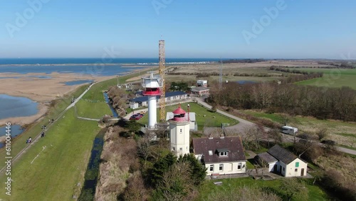 Luftaufnahme der Leuchttürme an der Ostseeküste von der Insel Fehmarn mit blauem Meer, Strand, Dünen und klarem Himmel: Magische Wächter der Küste photo