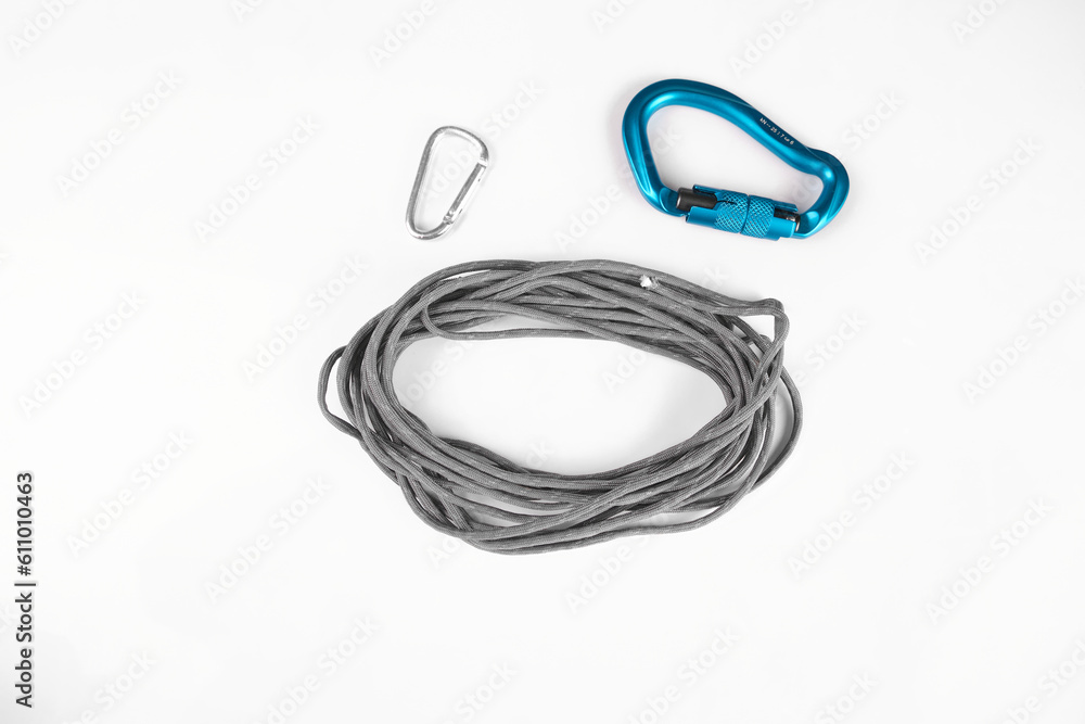 paracord gray tactical for survival untied assembled on white background with carabiners large blue and small silver paracord gray tactical for survival untied assembled on white background with carabiners large blue and small silver
