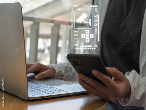 CCTV on smartphone. Digital. User monitoring modern CCTV on smartphone. on the virtual window housing safety