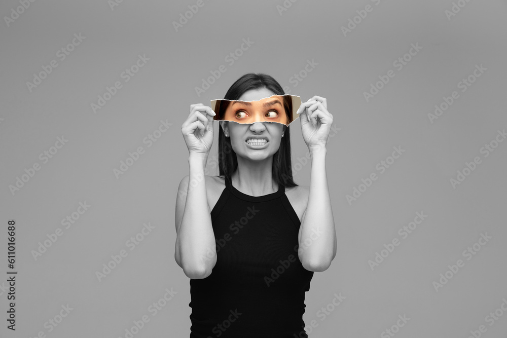 Black and white image of young girl holding colorful photo part, model expressing anger and irritation. Creative collage.