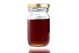 Honey in a glass jar with reflection isolated on white background.