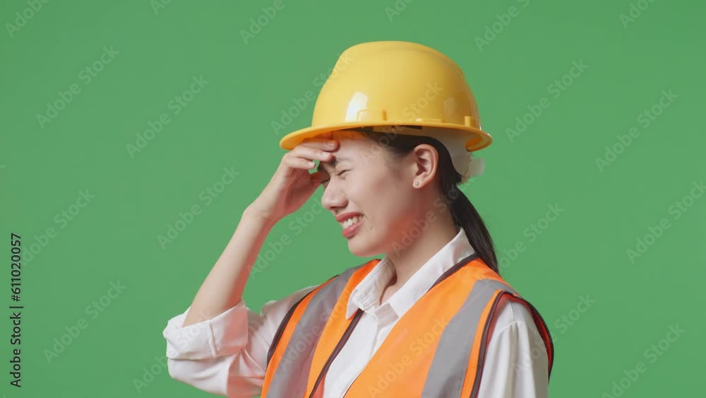 Close Up Side View Of Asian Female Engineer With Safety Helmet Having A Headache While Working In The Green Screen Background Studio
Close Up Side View Of Asian Female Engineer With Safety Helmet Having A Headache While Working In The Green Screen Background Studio