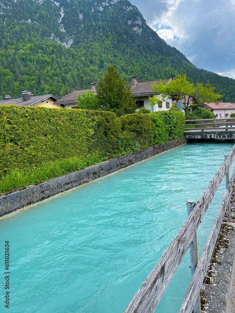channel in the alps with green and blue water