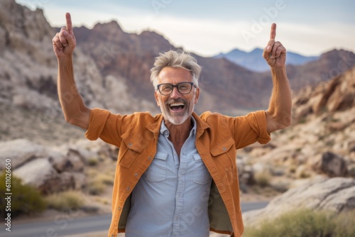 Lifestyle portrait photography of a glad mature man gesturing victory against a national park background. With generative AI technology