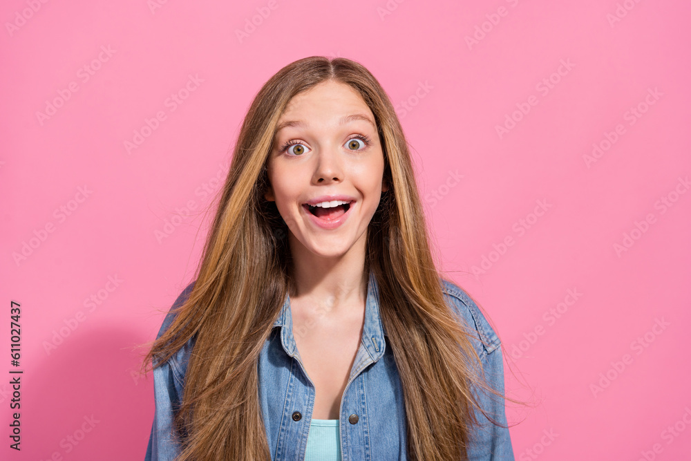 Photo portrait of lovely young teenager lady excited face shocked win lottery wear trendy jeans garment isolated on pink color background Photo portrait of lovely young teenager lady excited face shocked win lottery wear trendy jeans garment isolated on pink color background