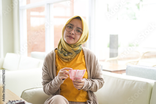business Asian hijab woman wearing Orange  T-shirt