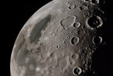 close-up of the moon, with craters and mountains visible, created with generative ai