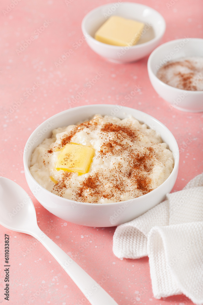 rice pudding with butter cinnamon. french riz au lait, norwegian risgrot, traditional breakfast dessert rice pudding with butter cinnamon. french riz au lait, norwegian risgrot, traditional breakfast dessert