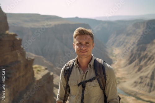 Medium shot portrait photography of a glad boy in his 30s walking against a scenic canyon background. With generative AI technology