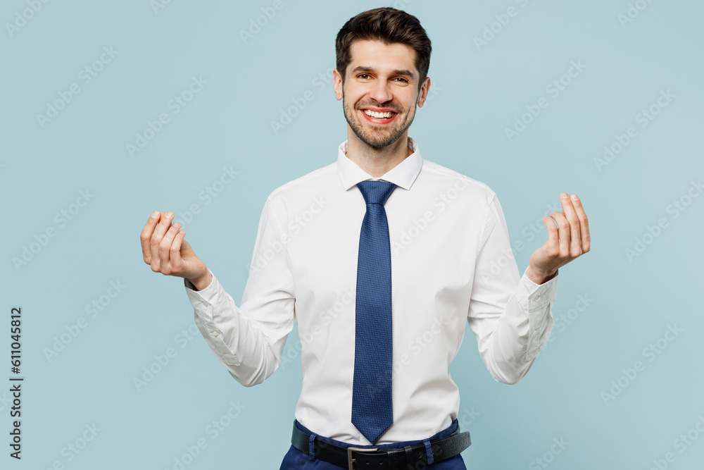 Young employee business man corporate lawyer wear classic formal shirt tie work in office rubbing fingers showing cash gesture asking for money isolated on plain pastel light blue background studio. Young employee business man corporate lawyer wear classic formal shirt tie work in office rubbing fingers showing cash gesture asking for money isolated on plain pastel light blue background studio.