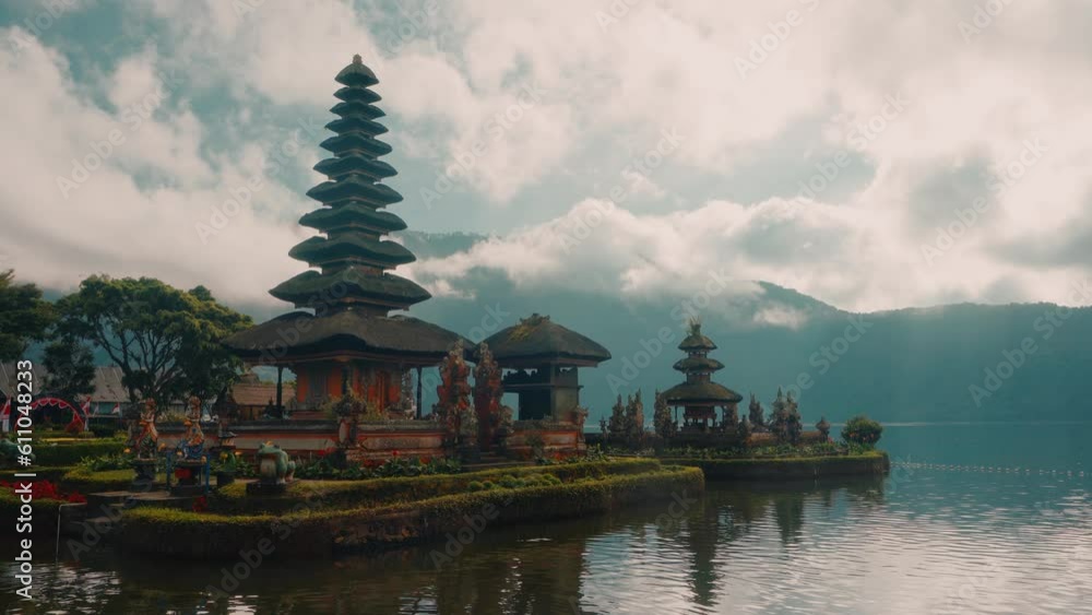 Bali temple Ulun Danu Beratan iconic Lake Temple, is both a famous picturesque landmark and a significant temple complex on the western side of Beratan Lake. Bali, Indonesia 4K Aerial view Bali temple Ulun Danu Beratan iconic Lake Temple, is both a famous picturesque landmark and a significant temple complex on the western side of Beratan Lake. Bali, Indonesia 4K Aerial view