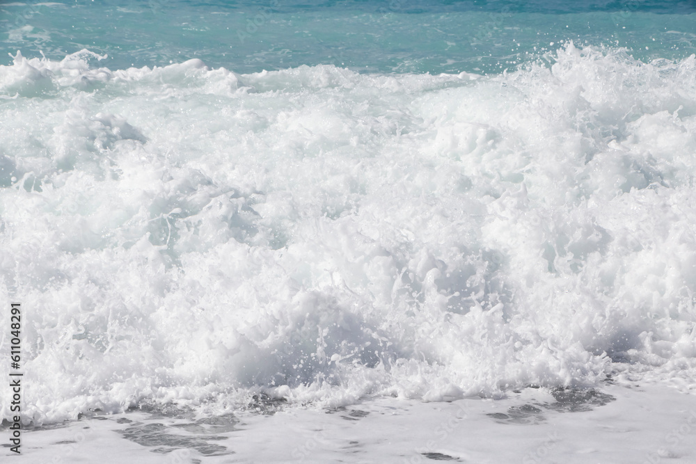 white foamy sea wave on beach in Nice