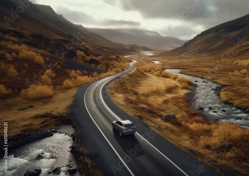 A car driving on a scenic road through a valley. Generative AI.