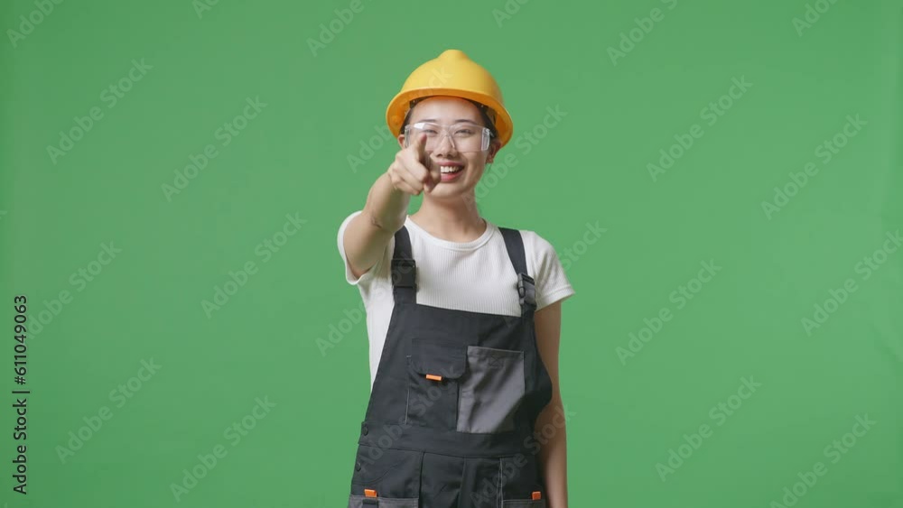 Asian Woman Worker Wearing Goggles And Safety Helmet Smiling, Waving Hand, And Saying Bye While Standing In The Green Screen Background Studio
Asian Woman Worker Wearing Goggles And Safety Helmet Smiling, Waving Hand, And Saying Bye While Standing In The Green Screen Background Studio
