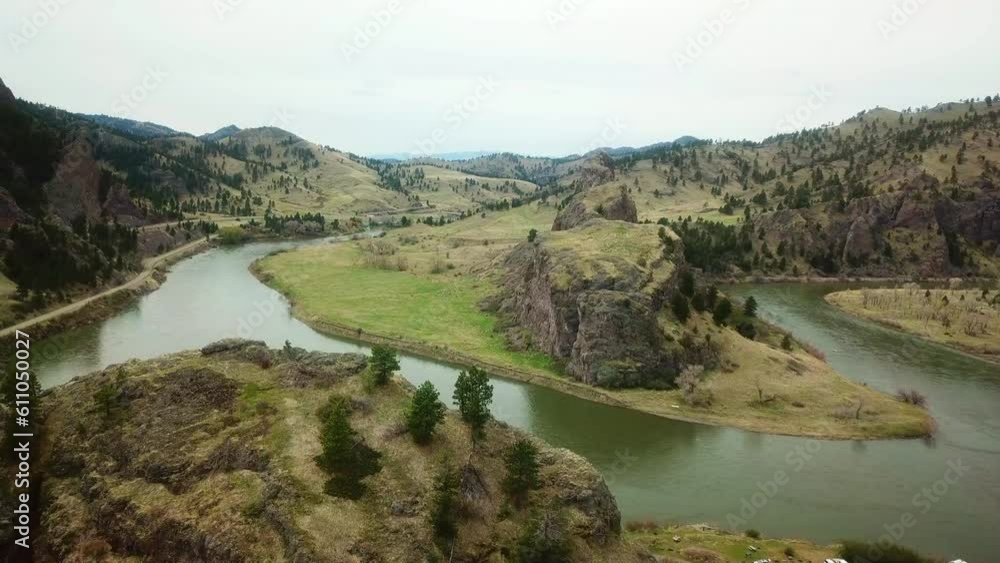 Aerial Shot Of River Passing By Rocky Cliff, Drone Flying Over Landscape - Billings, Montana Aerial Shot Of River Passing By Rocky Cliff, Drone Flying Over Landscape - Billings, Montana