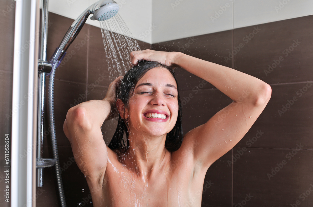 woman in shower washes in hair - obrazy, fototapety, plakaty 