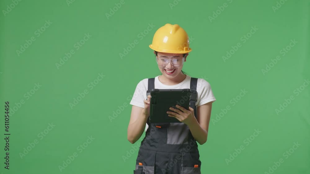 Asian Woman Worker Wearing Goggles And Safety Helmet Using A Tablet While Standing In The Green Screen Background Studio
Asian Woman Worker Wearing Goggles And Safety Helmet Using A Tablet While Standing In The Green Screen Background Studio