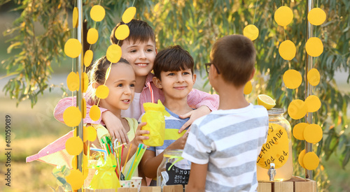 Cute children selling lemon...
