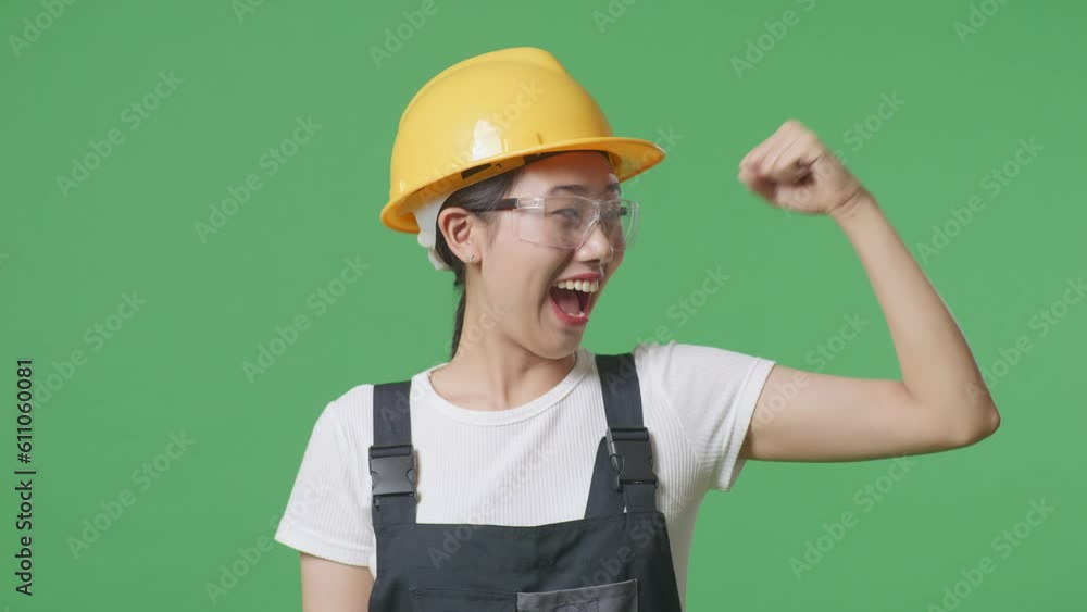 Close Up Of Asian Woman Worker Wearing Goggles And Safety Helmet Smiling And Flexing Her Bicep While Standing In The Green Screen Background Studio
Close Up Of Asian Woman Worker Wearing Goggles And Safety Helmet Smiling And Flexing Her Bicep While Standing In The Green Screen Background Studio