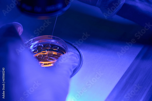 Photos Genetic laboratory technician doing embryo biopsy in clinic