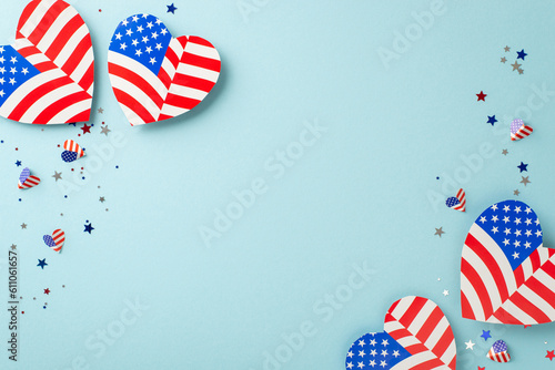 Independence Day USA merriments. From top view, observe emblematic decorations: hearts with American flag pattern, shimmering confetti, showcased on light blue backdrop with blank space for text or ad photo