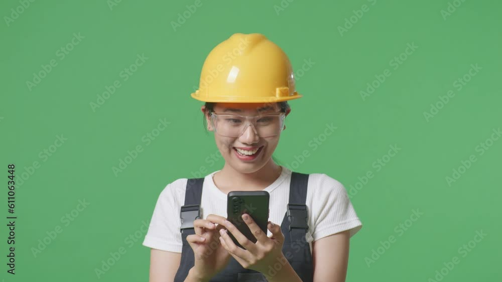 Close Up Of Asian Woman Worker Wearing Goggles And Safety Helmet Using Smartphone And Pointing To Side While Standing In The Green Screen Background Studio
Close Up Of Asian Woman Worker Wearing Goggles And Safety Helmet Using Smartphone And Pointing To Side While Standing In The Green Screen Background Studio