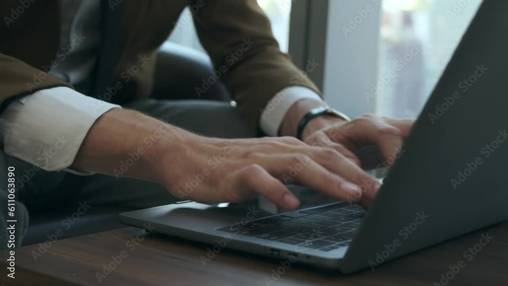 Caucasian business man's hands typing on laptop keyboard at modern office. Caucasian business man's hands typing on laptop keyboard at modern office.