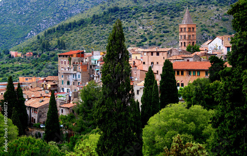 View of the historic part of the city of Tivoli (Italy) with the bell tower of the Cathedral and green hills in the background