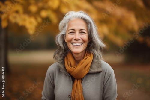 Medium shot portrait photography of a glad mature woman smiling against an autumn foliage background. With generative AI technology