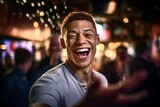 Close-up portrait photography of a glad boy in his 30s dancing against a lively sports bar background. With generative AI technology
