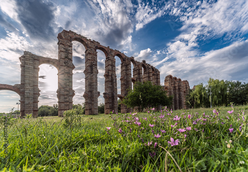 Mérida's Aqueduct of Miracles at sunset, with its ancient Roman architecture and imposing stone columns, this historical relic is an emblem of cultural heritage.