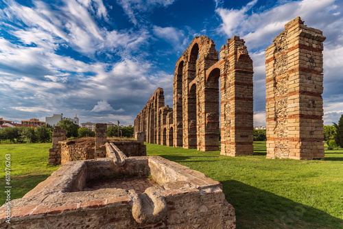 Mérida's Aqueduct of Miracles at sunset, with its ancient Roman architecture and imposing stone columns, this historical relic is an emblem of cultural heritage.