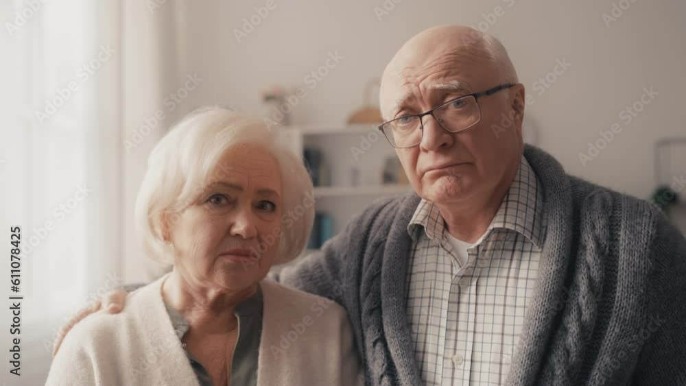 Portrait of sad wife and husband, unsatisfied couple with financial problems Portrait of sad wife and husband, unsatisfied couple with financial problems