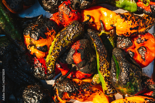 A pile of colorful charred roast peppers, closeup