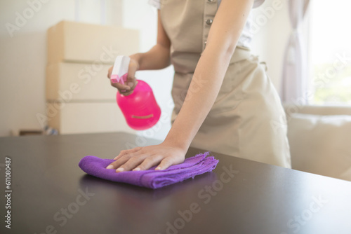 Fototapeta Naklejka Na Ścianę i Meble -  cleaning staff is cleaning room for customers who want  cleaning staff to clear room before staying in next round for cleanliness. concept of hiring Cleaner staff from the Cleaner Company
