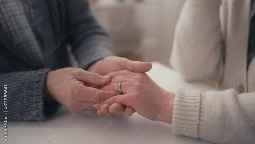 Closeup of senior man doing marriage proposal, giving engagement ring, happiness Closeup of senior man doing marriage proposal, giving engagement ring, happiness