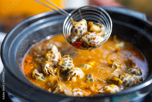 Bowl of sea snail in spicy sauce