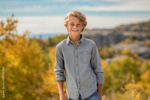 Medium shot portrait photography of a glad mature boy wearing comfortable jeans against a national park background. With generative AI technology