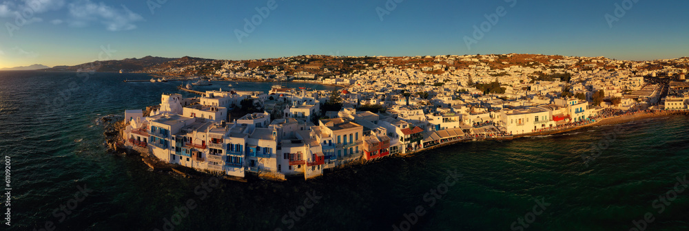 Aerial drone ultra wide panoramic photo of famous whitewashed traditional built by the sea houses called 