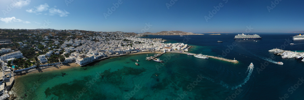 Aerial drone ultra wide high resolution photo of iconic, picturesque main town or hora and small old harbour of Mykonos island, Cyclades, Greece