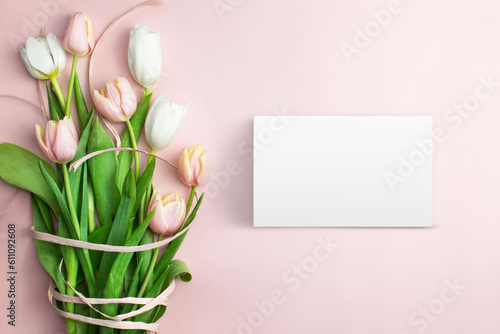 Composition of pink and white tulips, ribbons, blank card on a pink background. Tulips spring bouquet. Content for Birthday, Valentines Day, Womens day. Flat lay, top view, close up, copy space. #611092608