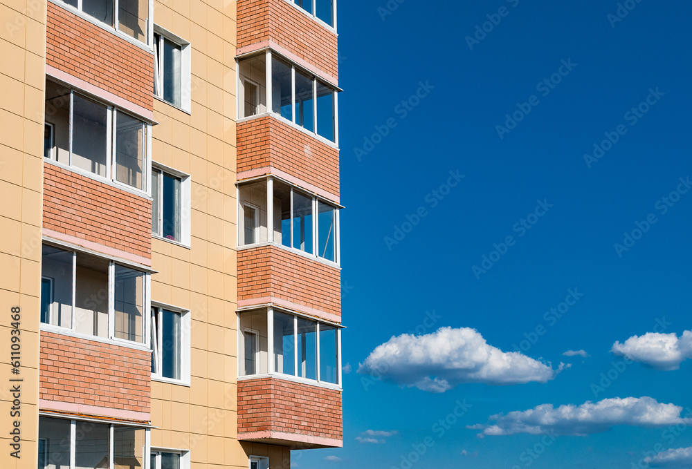Fragment of an apartment building against the sky.