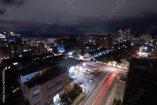 Beautiful night long exposure shot of popular neighborhood at bogota north city knowed as "cedritos" with traffic lights and apartment buildings