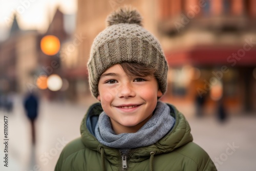 Headshot portrait photography of a grinning kid male wearing a warm beanie or knit hat against a picturesque old town background. With generative AI technology © Markus Schröder
