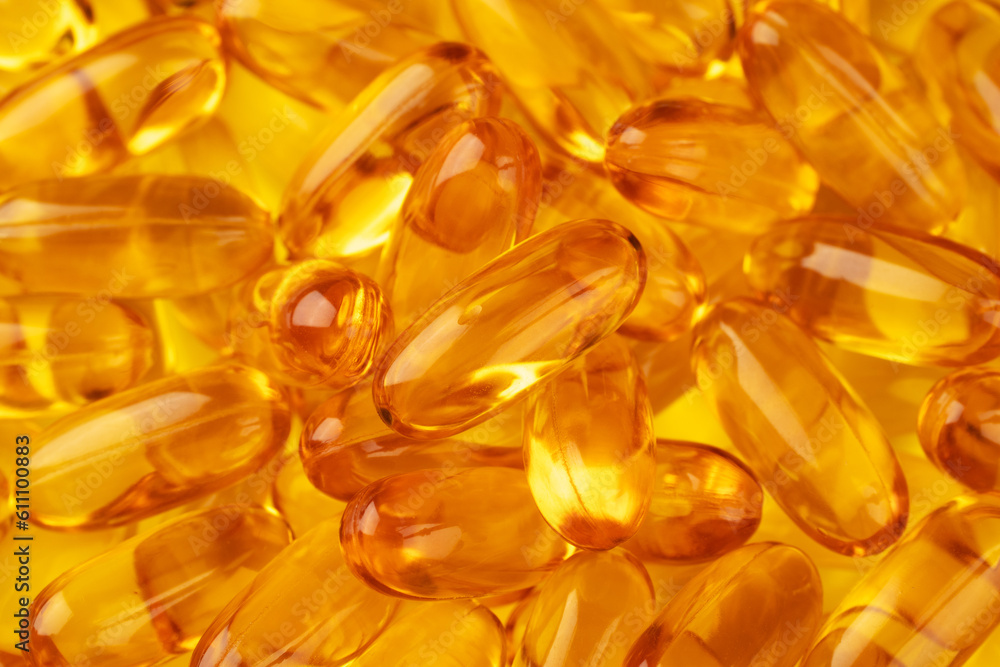 Capsules of fish oil as background, close-up shot Capsules of fish oil as background, close-up shot