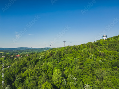 Panoramic drone view of a modern gondola lift with a lookout tower over the Solina water dam  in the Polish Bieszczady Mountains  Poland