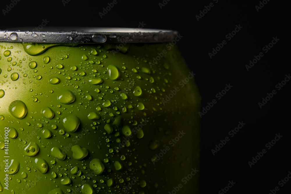 Green can of fresh soda with water drops on dark background, closeup Green can of fresh soda with water drops on dark background, closeup