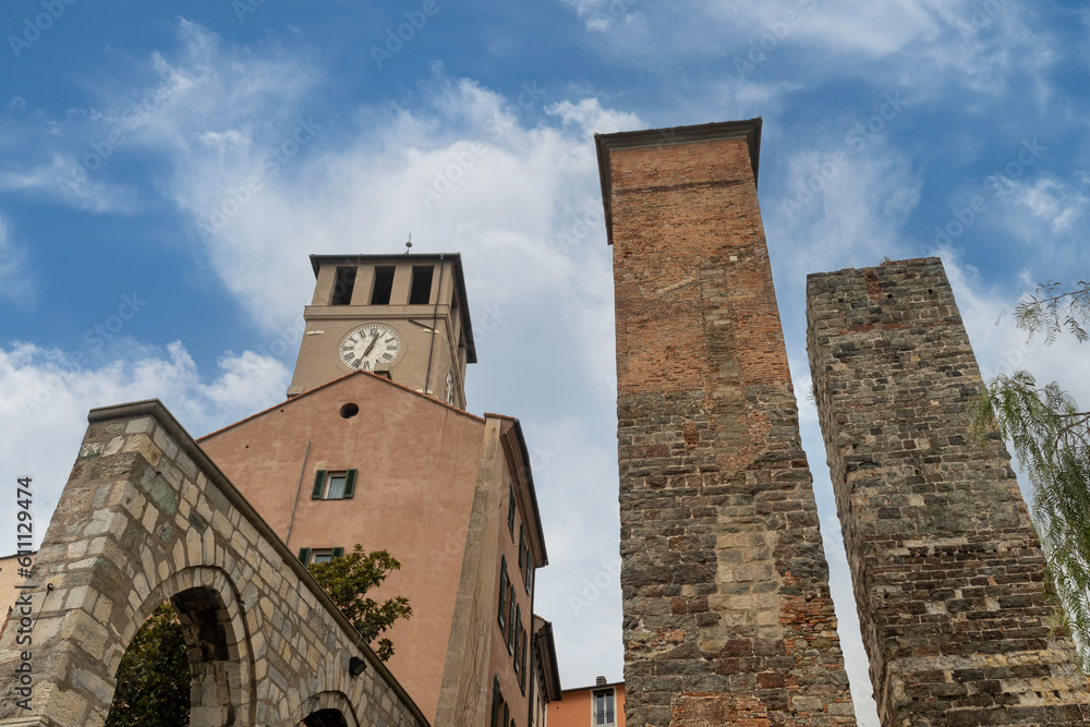 Low angle view of the medieval towers of Savona: the Brandale Tower, also called “Campanassa”, and the lower Riario and Corsi Towers (12th century), Savona, Liguria, Italy