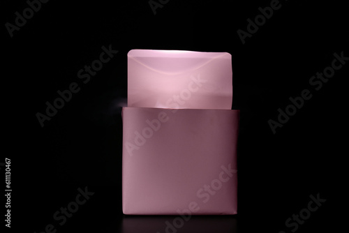 Camera flash in box on blac...