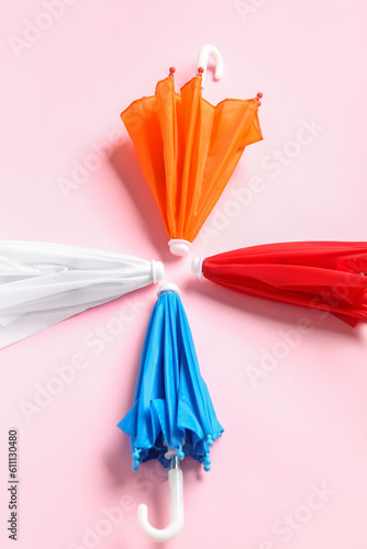 Colorful folded umbrellas a...